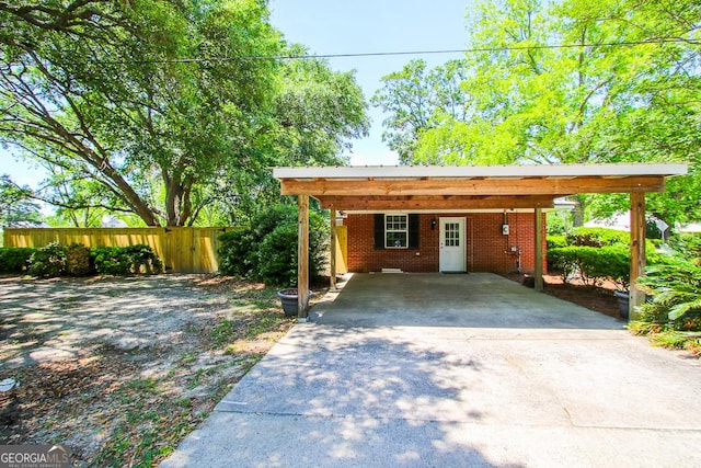 5034 W Ga Highway 292, Collins, GA 30421 - view of front of property featuring concrete driveway, brick siding, and fence