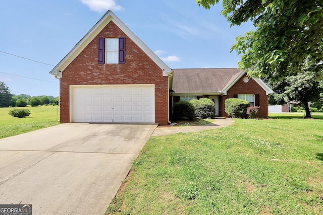 traditional-style home with brick siding, a front yard, and concrete driveway