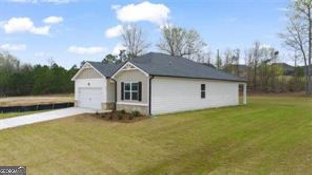 1406 Adirondac Way, Bonaire, GA 31005 - view of side of property featuring a garage, a yard, and concrete driveway