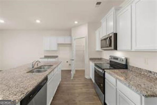 1406 Adirondac Way, Bonaire, GA 31005 - kitchen featuring recessed lighting, white cabinets, a sink, dark wood finished floors, and appliances with stainless steel finishes