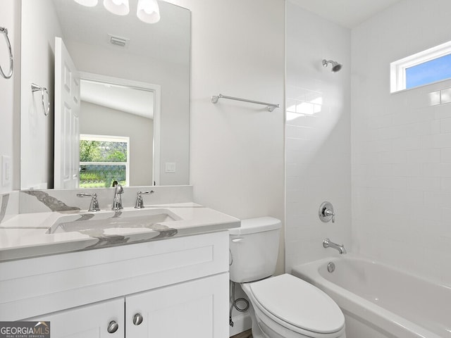 bathroom with shower / bath combination, vanity, toilet, and visible vents