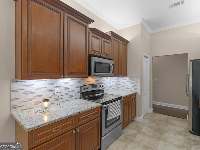 570 Mcgarity Dr, Mcdonough, GA 30252 - kitchen featuring appliances with stainless steel finishes, decorative backsplash, light stone counters, ornamental molding, and brown cabinetry