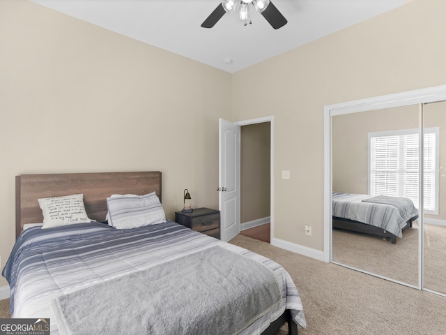 bedroom featuring carpet flooring, baseboards, ceiling fan, and a closet