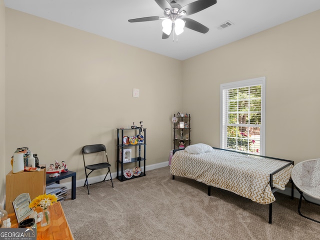 bedroom featuring carpet floors, baseboards, a ceiling fan, and visible vents