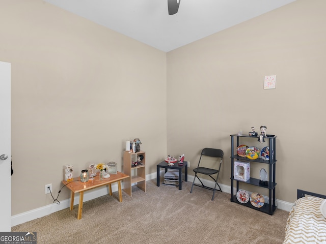 playroom featuring carpet floors, a ceiling fan, and baseboards