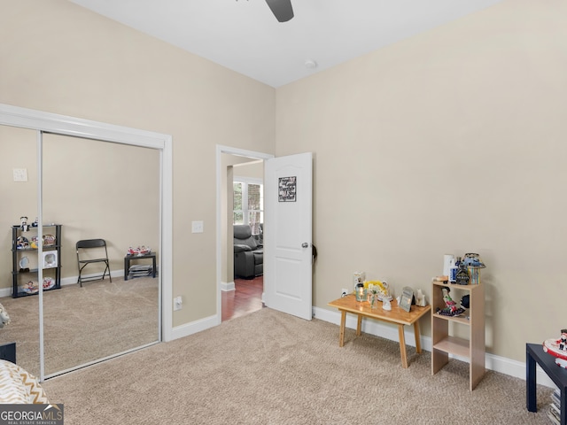 interior space featuring baseboards, ceiling fan, and a closet