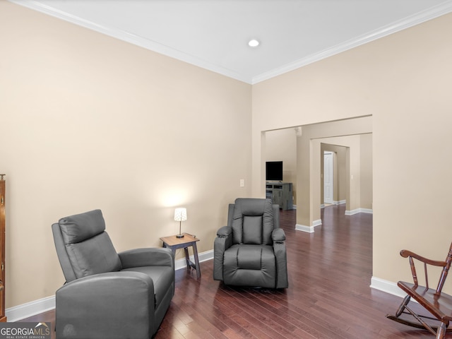 living area with recessed lighting, baseboards, ornamental molding, and dark wood-type flooring