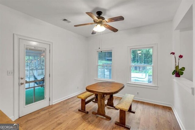 143 Navajo Trl, Rydal, GA 30171 - dining space featuring light wood-style floors, a ceiling fan, and baseboards