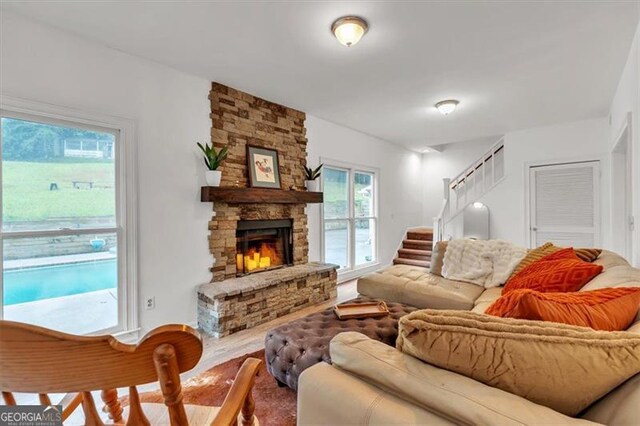 143 Navajo Trl, Rydal, GA 30171 - living room with a stone fireplace and wood finished floors