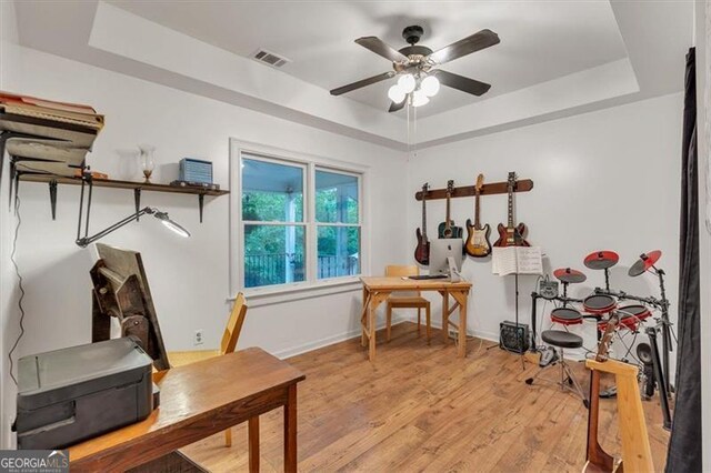 143 Navajo Trl, Rydal, GA 30171 - office featuring a tray ceiling, ceiling fan, light wood-type flooring, and baseboards