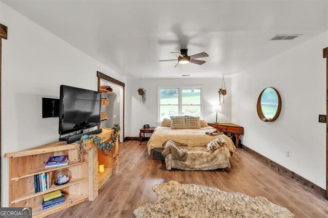 143 Navajo Trl, Rydal, GA 30171 - bedroom with wood finished floors, baseboards, and a ceiling fan