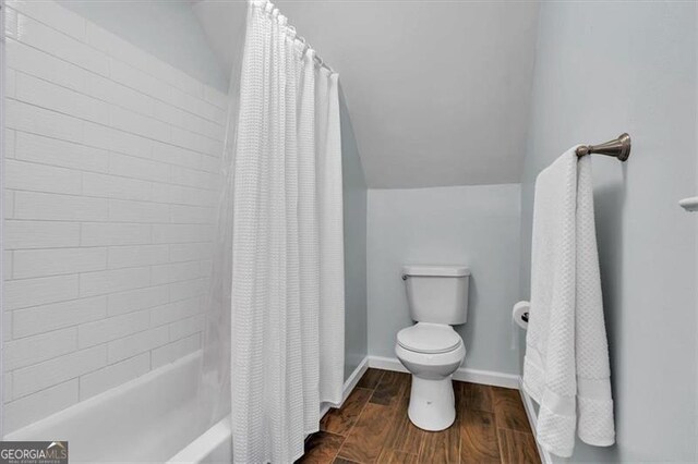 143 Navajo Trl, Rydal, GA 30171 - bathroom featuring toilet, wood finished floors, baseboards, and shower / bath combo