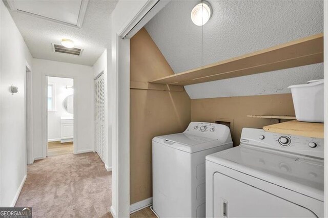143 Navajo Trl, Rydal, GA 30171 - laundry area with independent washer and dryer, light carpet, a textured ceiling, and baseboards