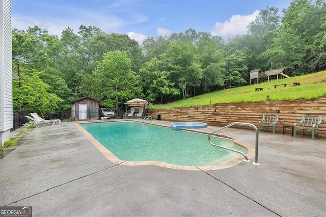 143 Navajo Trl, Rydal, GA 30171 - view of swimming pool with a patio, a storage unit, and an outbuilding