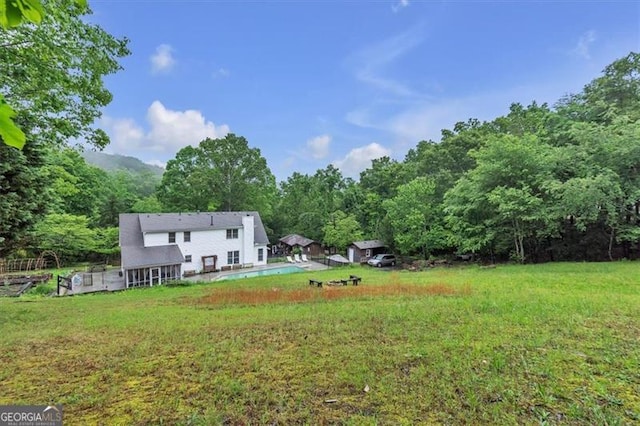 143 Navajo Trl, Rydal, GA 30171 - view of grassy yard featuring a forest view