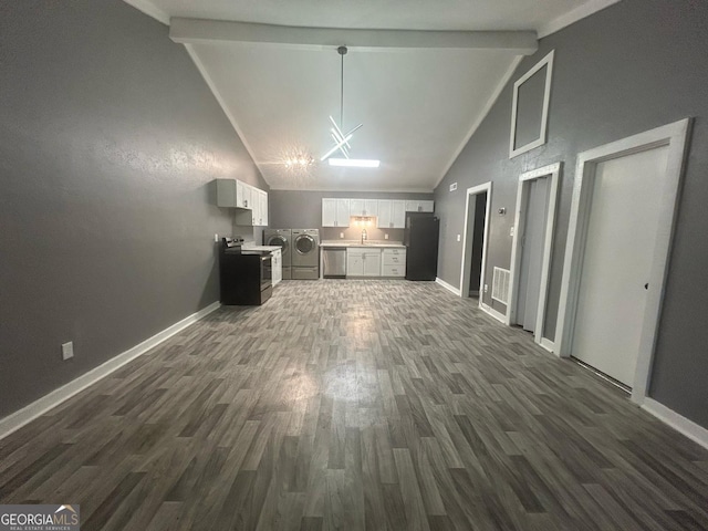 unfurnished living room featuring baseboards, washing machine and dryer, beam ceiling, and dark wood-type flooring