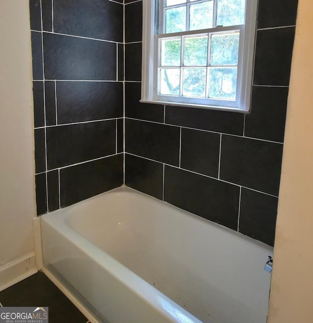 2074 Melton Ave, Macon, GA 31217 - full bathroom with a tub to relax in and baseboards
