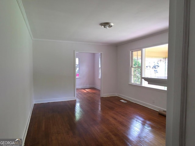 2074 Melton Ave, Macon, GA 31217 - spare room featuring wood-type flooring, crown molding, and baseboards