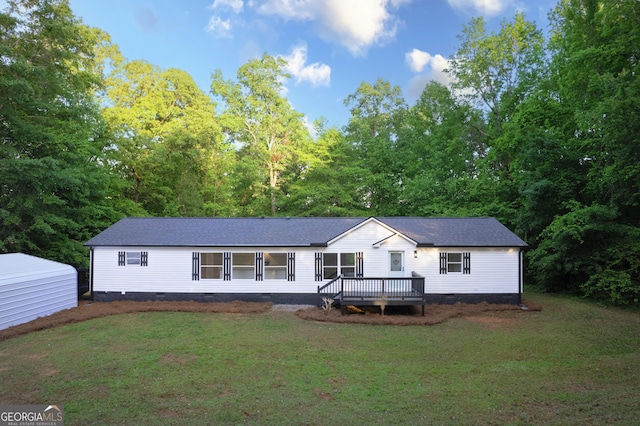 139 6th Street Ext, Milner, GA 30257 - view of front of home with crawl space, a front yard, a wooden deck, and roof with shingles