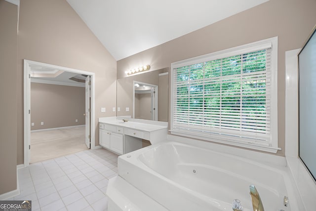 full bath with vanity, tile patterned floors, vaulted ceiling, and a tub with jets