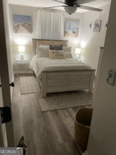 bedroom featuring ceiling fan and wood finished floors