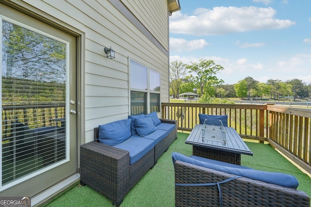 wooden terrace with outdoor lounge area