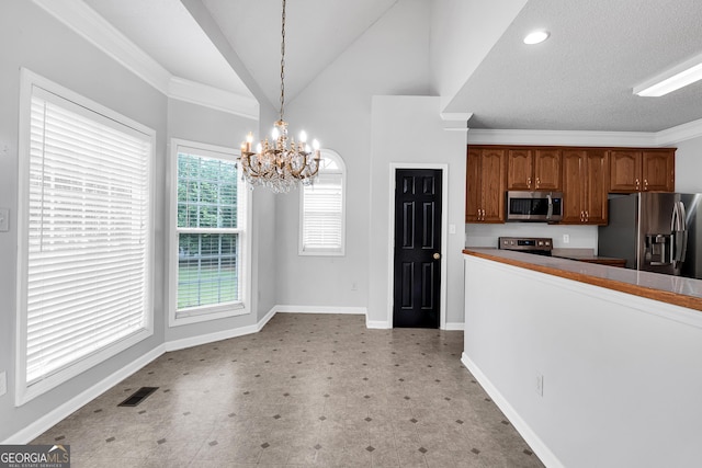 kitchen with light floors, baseboards, an inviting chandelier, visible vents, and appliances with stainless steel finishes