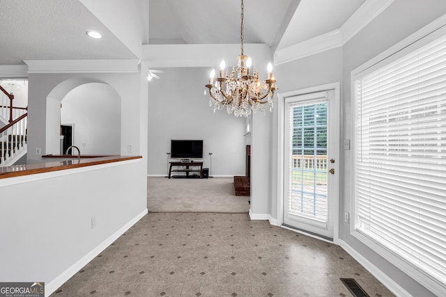 unfurnished dining area with a notable chandelier, baseboards, visible vents, stairs, and tile patterned floors