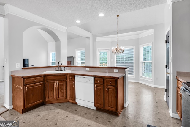 kitchen with recessed lighting, dishwasher, a healthy amount of sunlight, and a sink