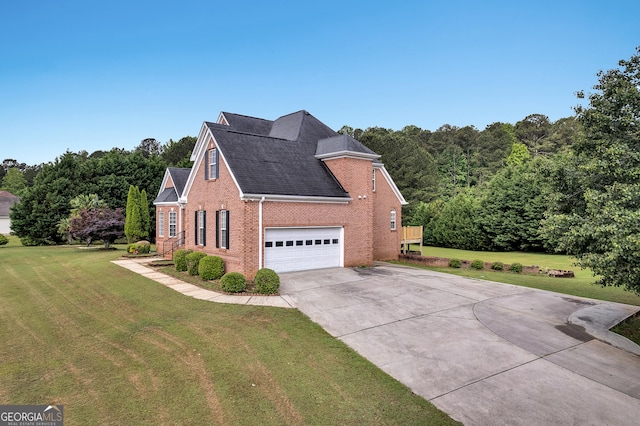 view of side of home with brick siding, driveway, a garage, a lawn, and a shingled roof