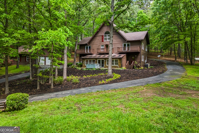 339 Ben Loudermilk Rd, Mount Airy, GA 30563 - view of front facade featuring a deck, a front lawn, central AC, and driveway