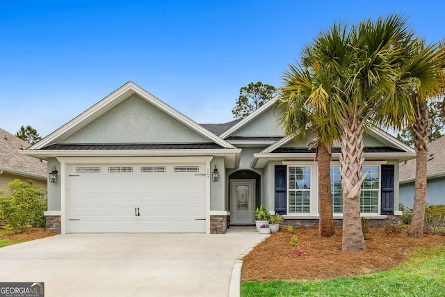 107 Amanda Trce, Kingsland, GA 31548 - view of front facade featuring stucco siding, stone siding, driveway, and a garage