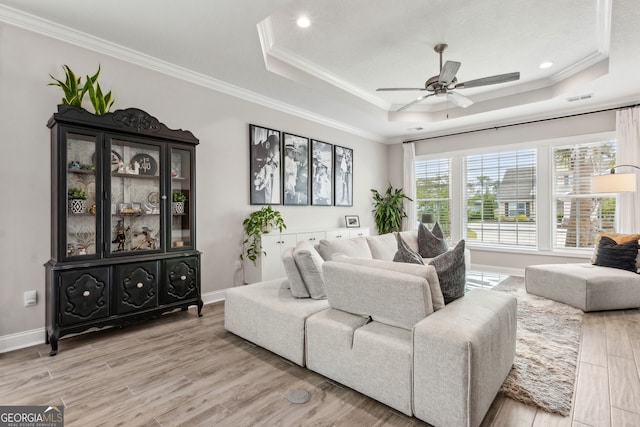 107 Amanda Trce, Kingsland, GA 31548 - living area with a raised ceiling, a ceiling fan, light wood-type flooring, ornamental molding, and baseboards