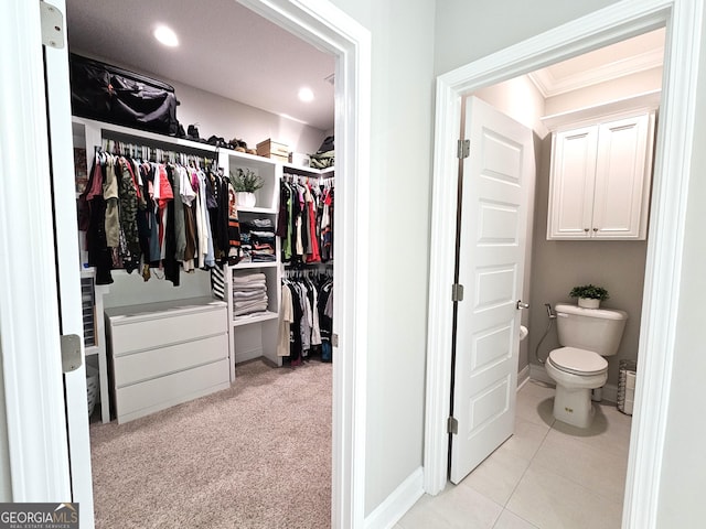 107 Amanda Trce, Kingsland, GA 31548 - bathroom featuring a spacious closet, toilet, recessed lighting, crown molding, and tile patterned floors