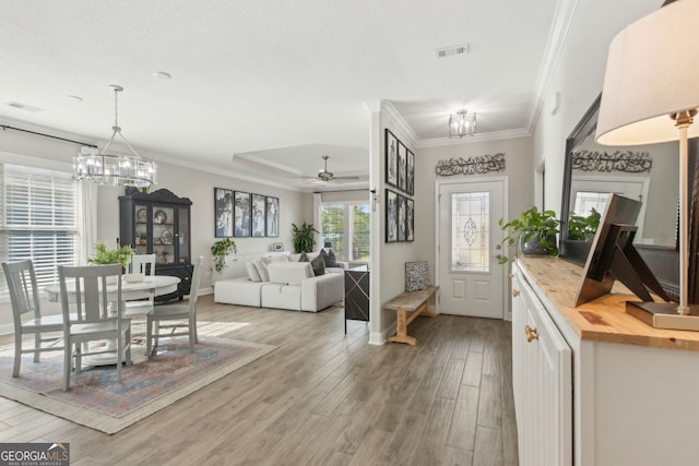 107 Amanda Trce, Kingsland, GA 31548 - foyer entrance with a chandelier, light wood-type flooring, crown molding, ceiling fan, and baseboards