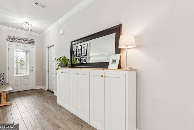 107 Amanda Trce, Kingsland, GA 31548 - entryway featuring crown molding, baseboards, and light wood finished floors