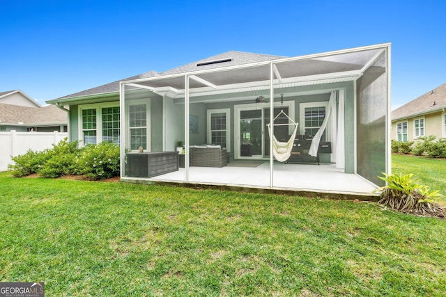 107 Amanda Trce, Kingsland, GA 31548 - back of property with a patio area, ceiling fan, and glass enclosure