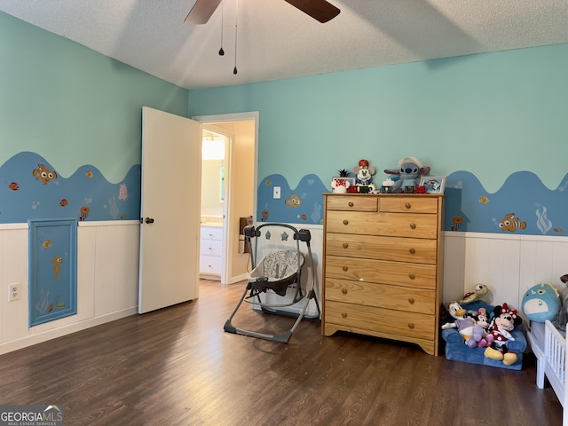1685 Ridgeway Rd, Lafayette, GA 30728 - bedroom with wainscoting, wood finished floors, a textured ceiling, and ceiling fan
