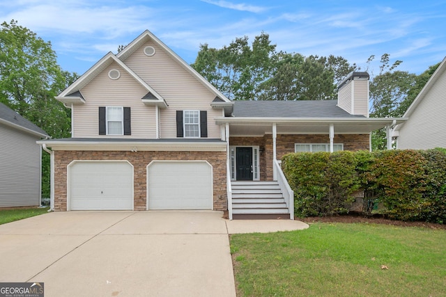 5975 Tate Dr, Austell, GA 30106 - split level home featuring a chimney, a front lawn, concrete driveway, an attached garage, and stone siding