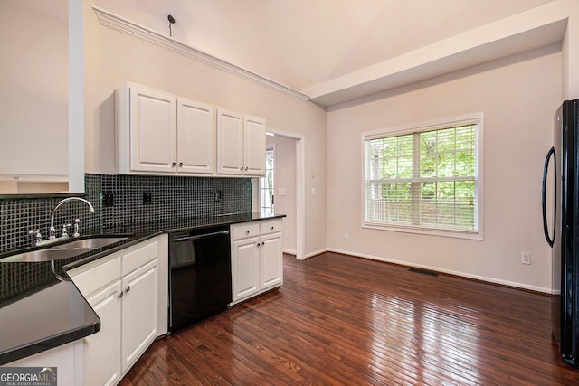 5975 Tate Dr, Austell, GA 30106 - kitchen featuring visible vents, dark countertops, dark wood-type flooring, a sink, and black appliances