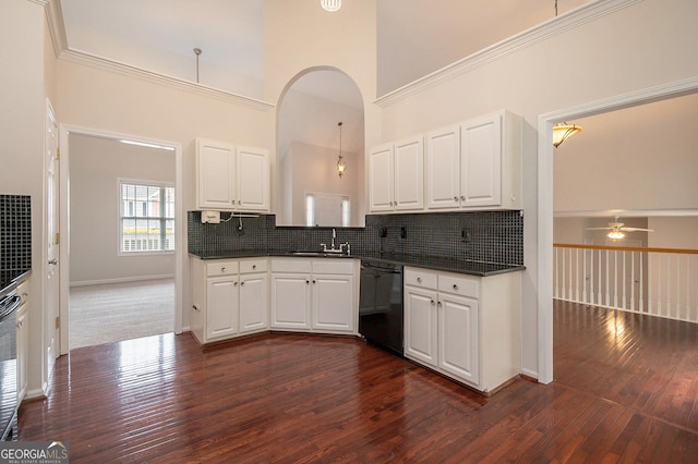 5975 Tate Dr, Austell, GA 30106 - kitchen with dark countertops, ceiling fan, a sink, dishwasher, and dark wood-type flooring