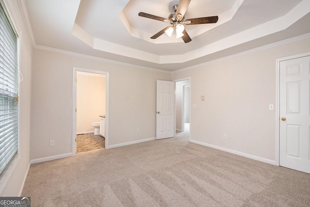 5975 Tate Dr, Austell, GA 30106 - unfurnished bedroom featuring crown molding, carpet floors, ensuite bathroom, and a tray ceiling