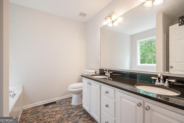 5975 Tate Dr, Austell, GA 30106 - bathroom with visible vents, a sink, a bath, and double vanity