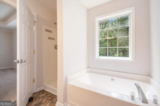 5975 Tate Dr, Austell, GA 30106 - full bathroom with plenty of natural light, a garden tub, and a stall shower