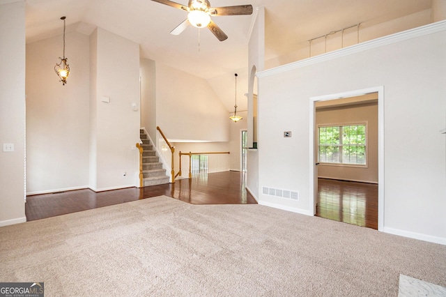 5975 Tate Dr, Austell, GA 30106 - unfurnished living room featuring carpet floors, ceiling fan, visible vents, and high vaulted ceiling