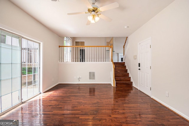 5975 Tate Dr, Austell, GA 30106 - unfurnished living room with visible vents, wood finished floors, a wealth of natural light, and stairway