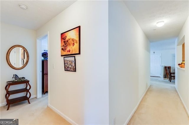 10202 Fairington Ridge Cir, Lithonia, GA 30038 - hall with baseboards and light colored carpet