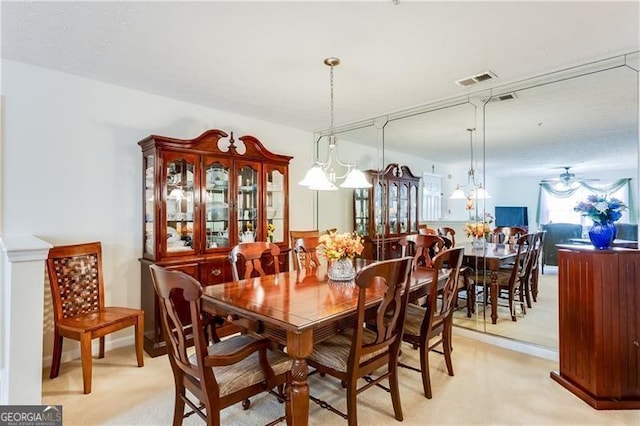 10202 Fairington Ridge Cir, Lithonia, GA 30038 - dining area featuring visible vents, a ceiling fan, and light carpet