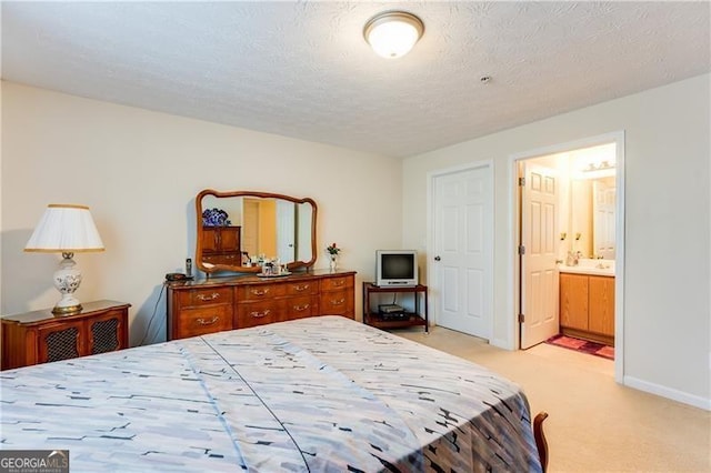 10202 Fairington Ridge Cir, Lithonia, GA 30038 - bedroom featuring baseboards, a textured ceiling, ensuite bath, and light carpet