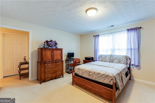 10202 Fairington Ridge Cir, Lithonia, GA 30038 - bedroom with a textured ceiling, baseboards, light colored carpet, and visible vents